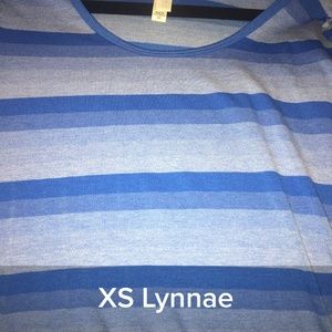 Brand new with tags. Lularoe Lynnae Tee - XS